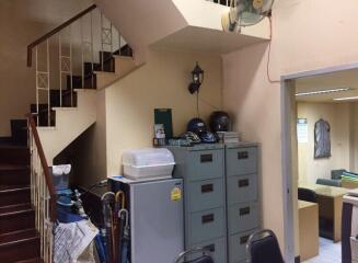 Staircase and adjacent storage area in a room