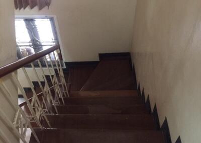 Wooden staircase with white railing