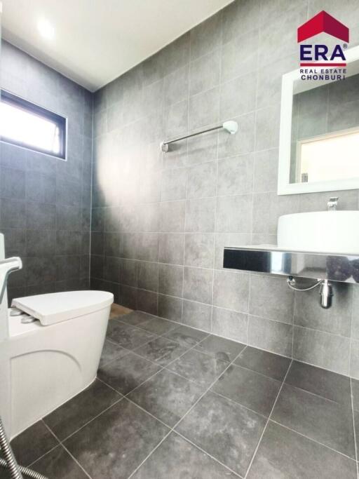 Modern bathroom with tiled walls and floor