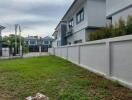 Exterior view of residential buildings with a lawn area