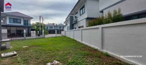 Exterior view of residential buildings with a lawn area