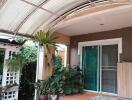 Outdoor balcony with plants and seating area