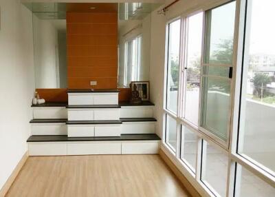 Living room with built-in storage steps and large sliding glass doors