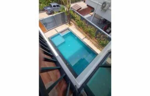 Top view of a swimming pool in a backyard