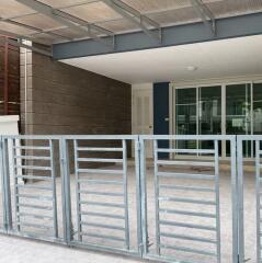 Covered outdoor area with gate