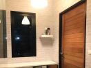 Modern bathroom with wooden door and white brick walls