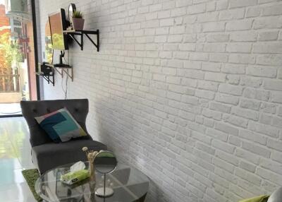 Modern living room with white brick wall