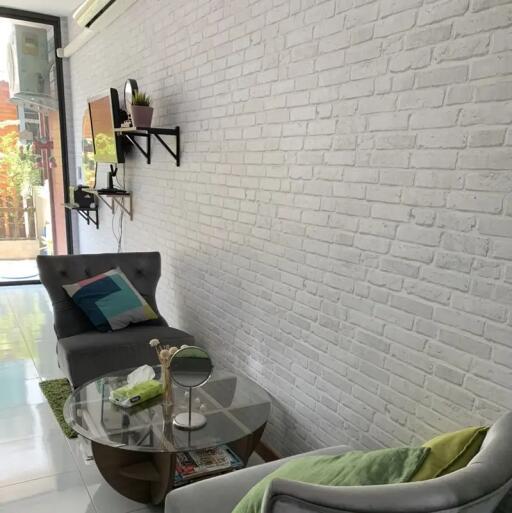 Modern living room with white brick wall