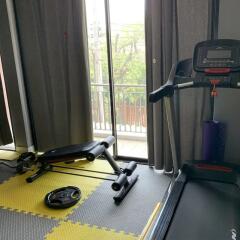 Home gym with exercise equipment and a view of the balcony