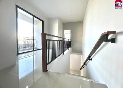 well-lit stairway area with windows