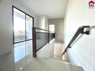 well-lit stairway area with windows