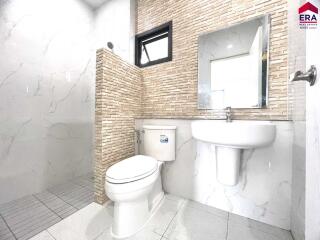 Modern bathroom with tiled walls and a walk-in shower