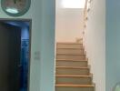 well-lit staircase with wooden steps and modern decor