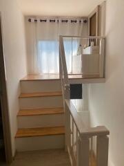 Staircase with window and natural light