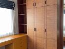 Bedroom with wooden wardrobe and desk