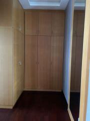 Bedroom with ample wooden closet space