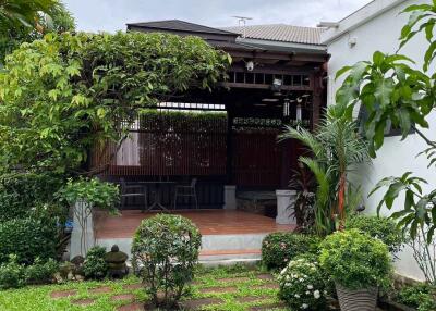 Beautiful garden area with a patio and lush greenery