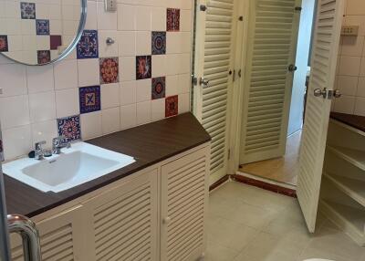 Bathroom with vanity and decorative tiles