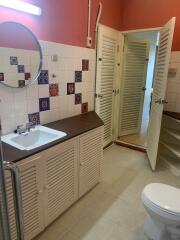 Bathroom with vanity and decorative tiles