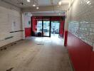 Empty commercial space with tiled walls and floor