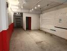 Empty room with tiled floor and red and white painted walls