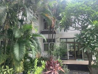 Exterior view of a house with lush greenery