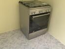 Kitchen with stove and tiled floor