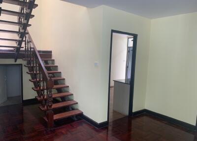 Living area with wooden staircase