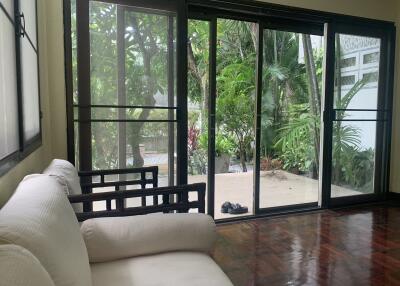 Living room with large windows and view of the garden