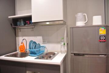 Compact kitchen with appliances and storage