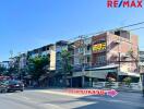 Street view of commercial buildings with RE/MAX signage