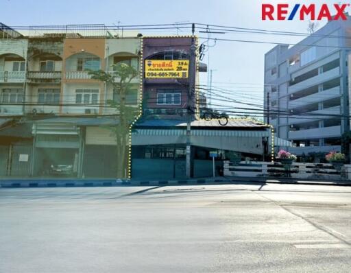 Street view of multiple buildings including a RE/MAX office