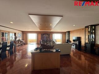 Spacious living area with wooden flooring and modern decor