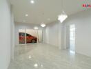 Spacious living room with tiled floor and modern lighting