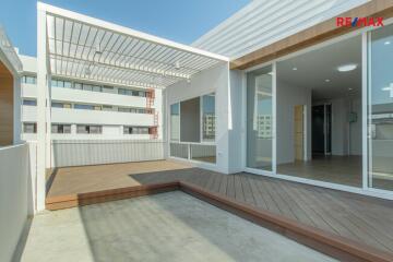 Modern outdoor patio with wooden deck