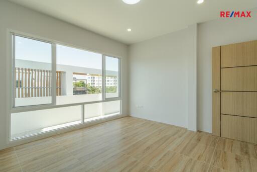 Bright bedroom with large windows