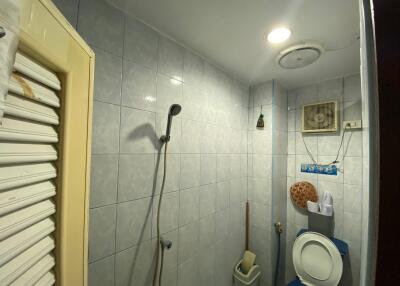 Small bathroom with shower and toilet