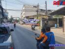 Outdoor neighborhood street view with people riding motorcycles and road signs