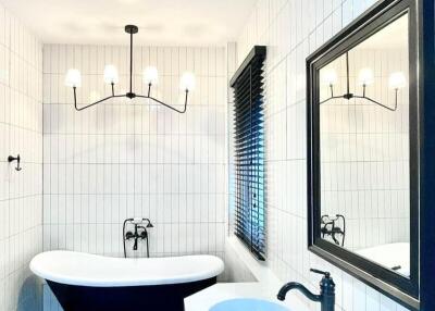 Modern bathroom with a freestanding bathtub and a vessel sink