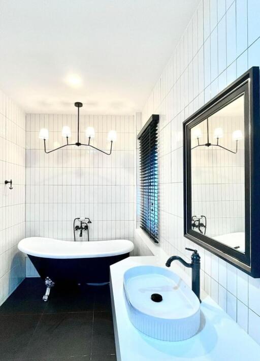 Modern bathroom with a freestanding bathtub and a vessel sink