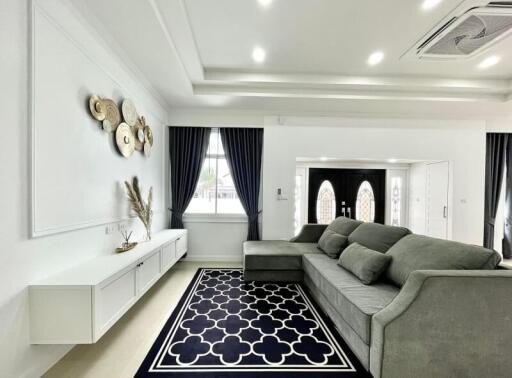 Modern living room with grey sofa and elegant decor