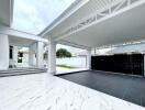 Modern covered carport with adjacent house entrance