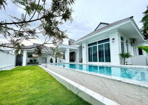 Modern house with swimming pool and yard
