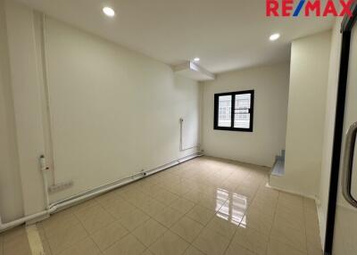 Modern living room with tiled flooring and recessed lighting