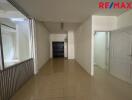 Unfurnished interior space with tiled floor