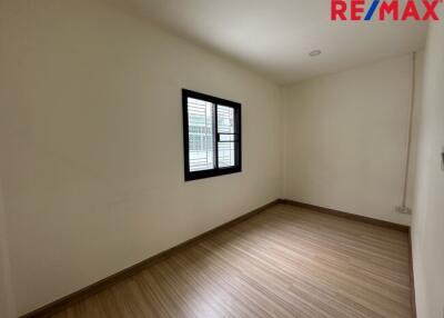 Empty room with a window and wooden floor