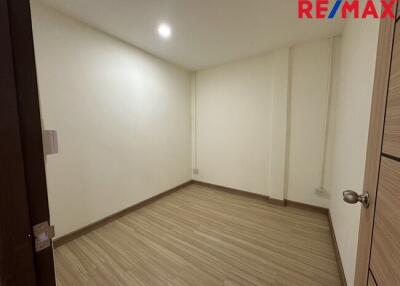 Empty room with wooden floor and white walls