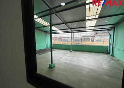 Covered outdoor area viewed through a window