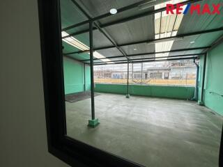 Covered outdoor area viewed through a window