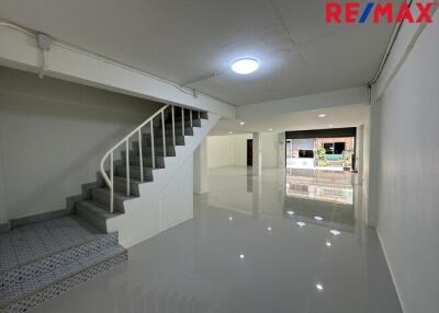 Spacious main living area with staircase and polished floor